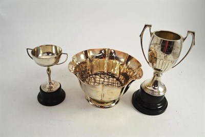 Lot 181 - A silver rose bowl engraved and dated 1918 and two silver trophy cups