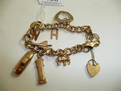 Lot 190 - A charm bracelet hung with ten charms