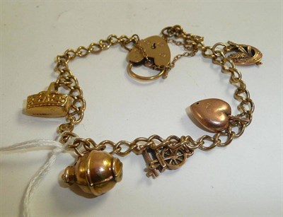 Lot 200 - A charm bracelet hung with five charms