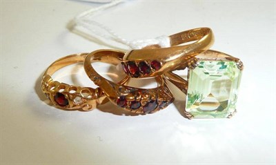 Lot 201 - Two garnet five stone rings, one hallmarked 9ct gold, one stamped '9CT', a ruby and diamond...