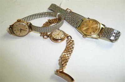 Lot 214 - A 9ct gold lady's wristwatch signed 'Movado', 9ct gold lady's wristwatch signed Omega and a...