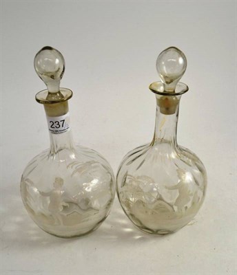 Lot 237 - A pair of Mary Gregory glass decanters and stoppers