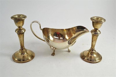 Lot 252 - Silver sauce boat and a pair of dwarf candle sticks