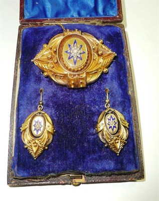 Lot 262 - A Victorian yellow metal, pearl and enamel brooch, complete with the ensuite earrings, bears...