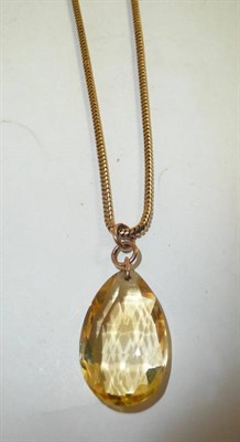 Lot 266 - A citrine drop on snake link chain