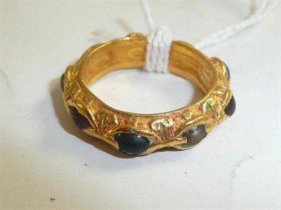 Lot 269 - A gem set full eternity ring in enamelled setting (a.f.)
