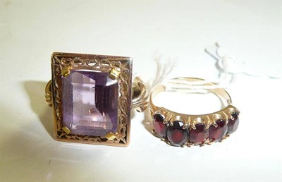 Lot 293 - An amethyst ring stamped '9ct' and a 9ct gold garnet five stone ring