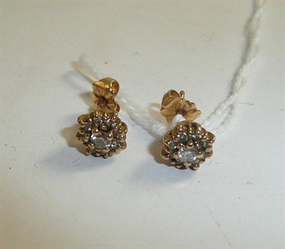 Lot 304 - A pair of diamond cluster earrings