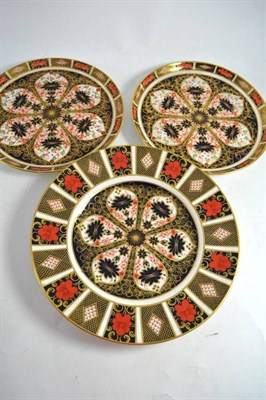 Lot 320 - A pair of Royal Crown Derby Imari circular plates and a larger example