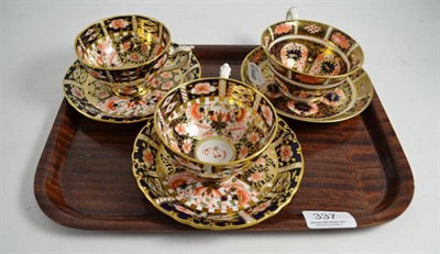 Lot 337 - Three Royal Crown Derby cups and saucers