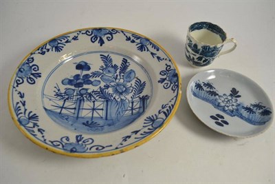 Lot 345 - A rare 18th century Delft saucer, a Salopian tea cup and 18th century Delft dish