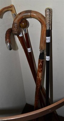 Lot 361 - Four silver mounted canes and a walking stick umbrella