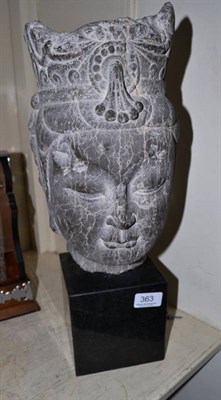 Lot 363 - An Eastern carved stone head