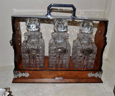 Lot 364 - A three division Tantalus with three silver labels Scotch, Port and Brandy