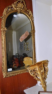 Lot 368 - A gilt mirror with arched top and a gilt wall bracket