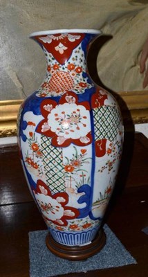 Lot 376 - A late 19th century Imari baluster vase with contemporary wooden stand