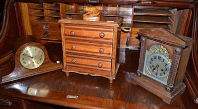 Lot 378 - An oak mantel clock with arched silvered dial, an oak mantel clock, an oak miniature chest of...