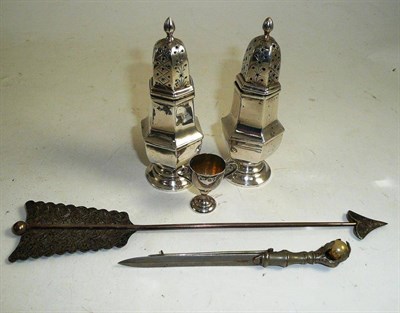 Lot 392 - A pair of silver pepperettes, miniature silver trophy cup, brooch modelled as a sword and a...