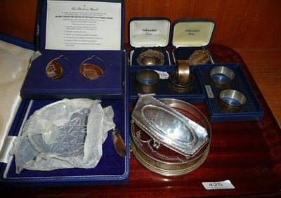 Lot 425 - A tray consisting of two silver ingots, five silver napkin rings, three silver labels etc