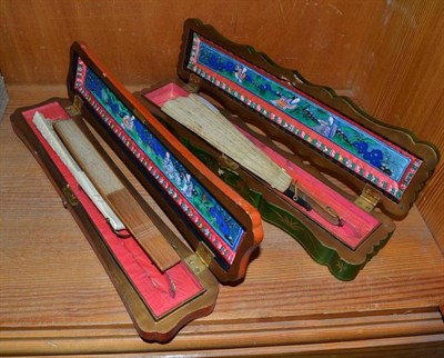 Lot 426 - Five Chinese painted fans in two lacquer boxes