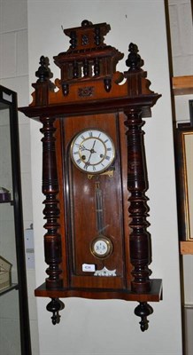 Lot 434 - A walnut spring driven Vienna style wall clock