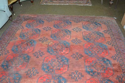 Lot 528 - Afghan Carpet Afghan Turkestan, the madder field with three columns of quartered elephant foot guls