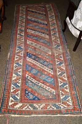 Lot 530 - Kazak rug Central Caucasus , the field with polychrome bands enclosed by ivory leaf and calyx...