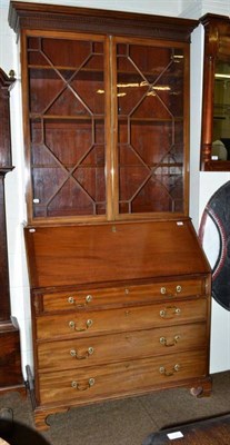 Lot 535 - A George III mahogany bureau bookcase with dentil fluted frieze above astragal glazed doors...