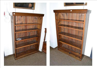 Lot 541 - A pair of oak five shelf adjustable open bookcases