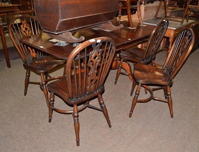 Lot 544 - A set of six Windsor chairs with decorative pierced splats, a reproduction cherry wood...