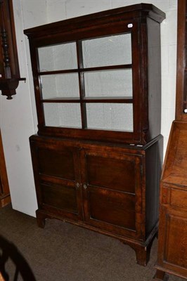 Lot 548 - A walnut display cabinet in 18th century style, with bold cornice above a glazed door between...