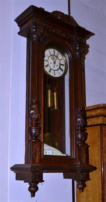 Lot 551 - A Victorian walnut double weight driven Vienna style wall clock