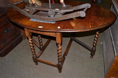 Lot 553 - Oak dining table with barley twist legs