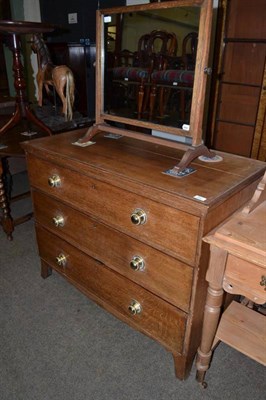 Lot 562 - A 19th century oak three drawer chest fitted later brass knob handles raised on bracket feet and an