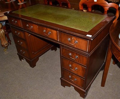 Lot 568 - A reproduction mahogany pedestal desk