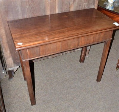 Lot 586 - A mahogany fold over tea table