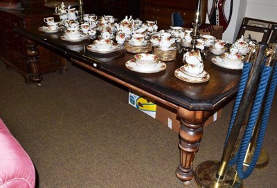 Lot 589 - Victorian oak wind-out dining table and two leaves