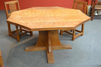 Lot 867A - A Robert  "Mouseman " Thompson Oak Octagonal 4' 4 " Dining Table, on a cruciform base, with...