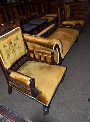 Lot 597 - A late Victorian parlour suite consisting a gentleman's armchair with padded back, arms and seat, a