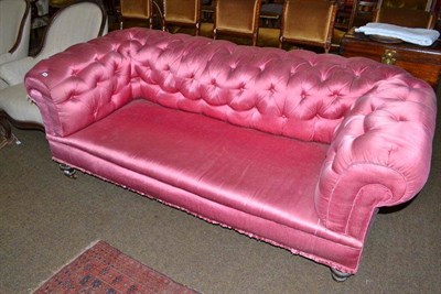 Lot 600 - A Victorian pink upholstered Chesterfield sofa