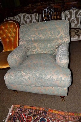 Lot 601 - A Multiyork cream and green upholstered armchair