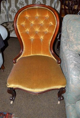 Lot 602 - A Victorian mahogany framed spoon back nursing chair, third quarter 19th century, with...