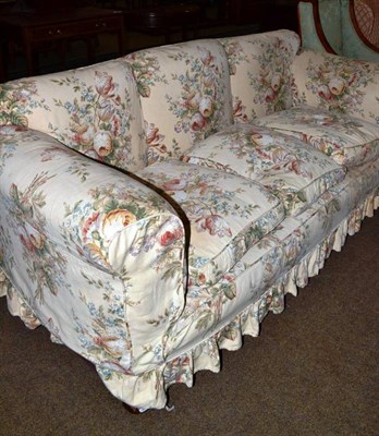 Lot 611 - A Victorian three seater settee with floral upholstered cover