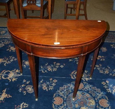 Lot 614 - Mahogany demi-lune card table