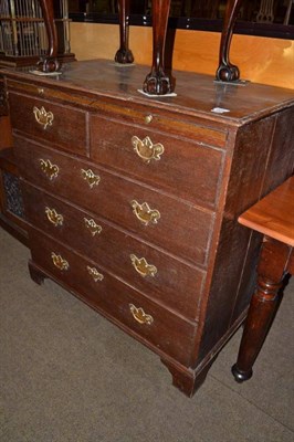 Lot 625 - Georgian oak four height chest with brushing slide