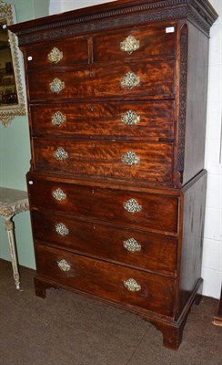 Lot 651 - A Georgian mahogany chest on chest with blind fret carved frieze and supports