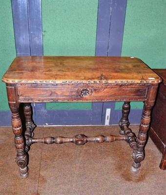 Lot 654 - An early 20th century carved oak side table with two end drawers