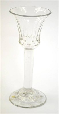 Lot 3 - A Wine Glass, circa 1740, the panelled bell shaped bowl on a plain stem and domed panelled...
