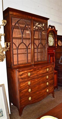 Lot 668 - A Regency mahogany secretaire bookcase with astragal glazed top and splayed bracket feet