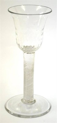 Lot 5 - A Wine Glass, circa 1740, the bell shaped bowl with basal hammering on an incised twist stem,...